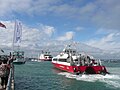 The rear of Red Funnel Red Jet 3, seen waiting at the Red Jet ferry terminal in Cowes, Isle of Wight. At the time the Gosport Ferry, Spirit of Portsmouth was using the terminal and as only one boat can fit on, the Red Jet had to wait.