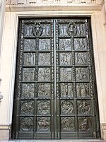 The right-hand bronze doors in the center portal Right hand bronze door at the Cathedral of St John the Divine, New York.jpg
