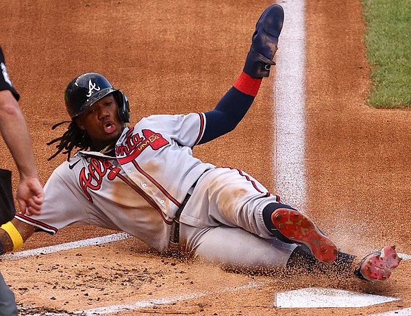 Acuña scoring a run during a 2020 game at Nationals Park.