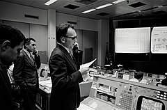 Dr. Lubos Kohoutek, discoverer of the Comet Kohoutek, speaks to the Skylab 4 crew via radio-telephone in the Mission Operations Control Room in the Mission Control Center during a visit to JSC.
