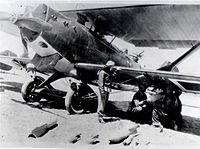 1937. Turkish air force pilot Sabiha Gokcen inspects her Breguet 19 as it is loaded with bombs. Sabiha Breguet 19.jpg