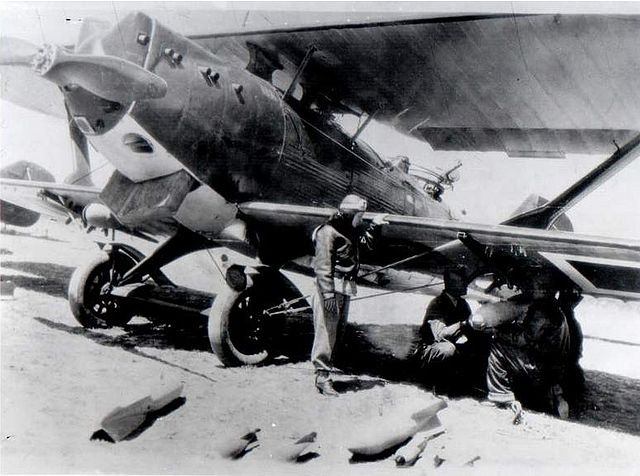 1937. Turkish air force pilot Sabiha Gökçen inspects her Breguet 19 as it is loaded with bombs.