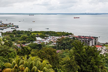 Timber ships at Bandar Leila (left), Kampung Lai Fu Kim (middle), Leila Complex (right) and abandoned Happy Cinema (at the very right side, partly covered by trees), seen from Puu Jih Shih Temple