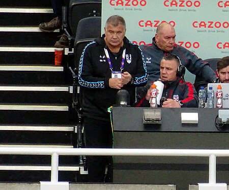 Wane alongside assistant Andy Last for England at the 2021 RLWC in 2022 Shaun Wane England.jpg