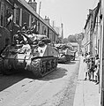 Sherman tanks of British 30th Corps passing through Bayeaux, liberated by the British 50th Infantry on 7 - 8 June 1944