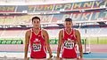 Singapore Decathletes Tan Yong Sheng (L) and Lance Tan (R) competing with black ribbons at the 2015 Malaysian Open as a mark of tribute to the late Mr Lee Kuan Yew.jpg