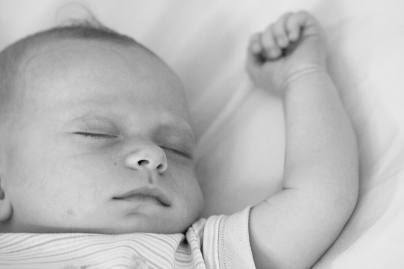 File:Sleeping baby with arm extended.jpg