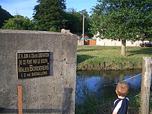 Plaque commemorating the liberation of a bridge in Normandy by the 2nd Battalion, South Wales Borderers on D-Day in June 1944. SouthWalesBorderersNormandyPlaque.JPG
