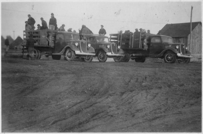 File:Supervision. The trucks are leaving as the men become seated. - NARA - 298379.tif