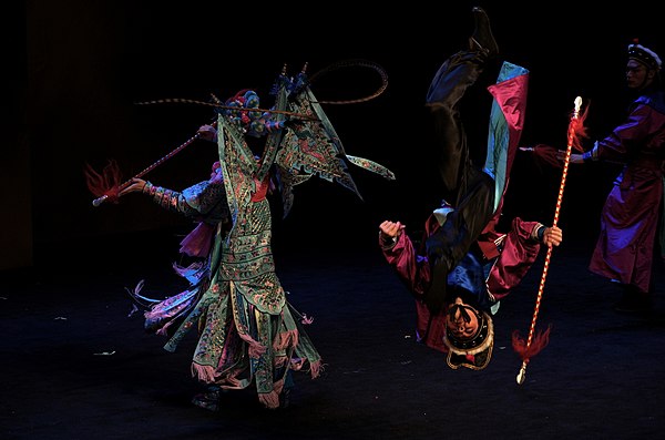 A Shao opera performance in Shanghai, China, 2014. This photo shows an acrobatic performer's somersault.