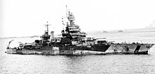 USS Colorado off Tinian, on 24 July 1944, with hull damage, the result of 22 hits from shore batteries USS Colorado 3.jpg
