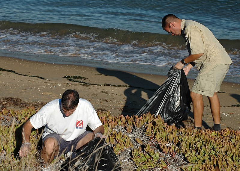 File:US Navy 051014-N-7286M-028 Aviation Support Equipment Technician 1st Class Nathan Morris and Aviation Support Equipment Technician 2nd Class Kenneth Potter place debris into trash bags.jpg