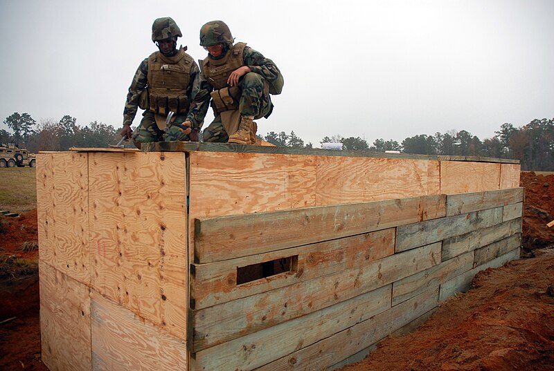 File:US Navy 081113-N-7367K-005 Steelworker Constructionman Recruit Nicholas Woodruff and Builder Constructionman Apprentice Domonic Fitzpatrick work together to help build a timber bunker.jpg