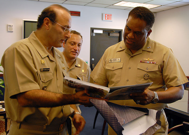 File:US Navy 090623-N-2821G-034 Peruvian Navy Rear Adm. Mario Luis Caballero Ferioli presents a gift to Rear Adm. Victor G. Guillory during an office call meeting.jpg