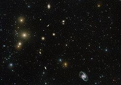 The Fornax Cluster by VLT Survey Telescope. NGC 1386 can be seen at lower centre left. VST image of the Fornax Galaxy Cluster.jpg