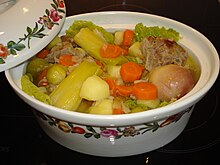 Hutspot Dutch, hochepot French or hotchpotch English, is a dish of boiled  and mashed potatoes, carrots and onions close up in the bowl on the table.  V Stock Photo - Alamy