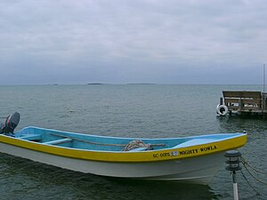 Mode of transportation and view of surrounding dock area, March 2010 Wee wee caye.jpg