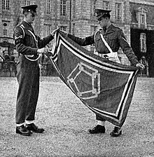 NCOs of the Corps of the Royal Military Police displaying the Western Union Standard outside Chateau de Courances on 1 October 1949 Western Union Standard.jpg