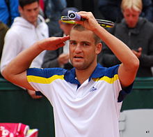 Youzhny after winning his second round match against world number 125 Federico Delbonis at the 2013 French Open Youzhny salute.jpg