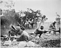 "Members of a Negro mortar company of the 92nd Division pass the ammunition and heave it over at the Germans in an almos - NARA - 535546.jpg