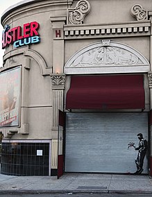 Waiting in Vain, Banksy's 24th installment, outside a Hustler Club in Hell's Kitchen "Waiting in Vain" Banksy in Hells Kitchen October 2013.jpg