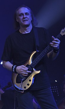 Гитарист Владимир Холстинин, один из основателей группы и единственный её бессменный участник, придумал название «Ария»