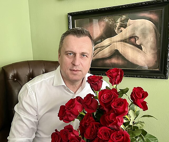 Andrej Danko holding flowers