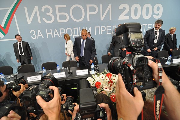 The leaders of GERB take their seats in front of reporters before giving a press conference after the election