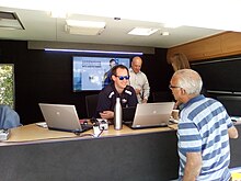 Presenters Gareth Parker and Simon Beaumont in the 6PR Jayco outside broadcasting caravan at the 2019 Have a Go Day 6PR ob unit.jpg