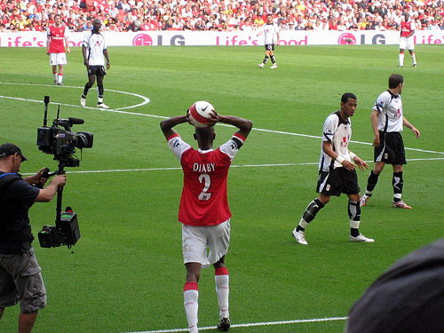 Arsenal defender Abou Diaby takes a throw-in