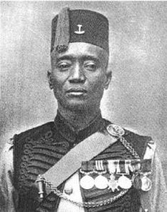 Sergeant Alhaji Grunshi of the Gold Coast Regiment WAFF in full dress uniform 1918