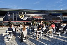 A diesel locomotive in dark blue paint