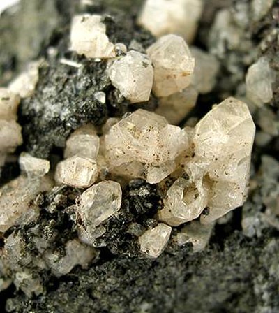 Anorthite crystals in a basalt vug from Vesuvius, Italy (size: 6.9 × 4.1 × 3.8 cm)