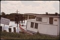 BAYOU FISHERMAN'S BOAT. SIGN AT LEFT MARKS HIGH PRESSURE GAS LINE FROM NEARBY HUMBLE GAS INSTALLATION - NARA - 544212.tif