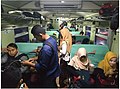 Tampak dalam kereta api Sibinuang (K3 08) saat jam sibuk. Kereta api ini menjual tiket berdiri dan kereta ekonomi buatan 2008 oleh INKA memiliki kursi 2-2 karena ukurannya lebih sempit.