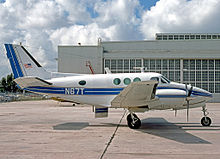 A pressurized Model 88 Queen Air built in 1966, with the model's distinctive circular fuselage windows Beech 65-88 Queen Air N67T OPA 29.09.79 edited-3.jpg