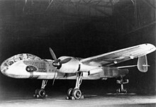 Ju 288 V1 prototype with twin BMW 801 engines. Is it being held in flying attitude by a support under the tail. The actuator rods for the landing gear's oleo struts are visible behind the main struts. Bundesarchiv Bild 146-1996-027-05A, Flugzeug Junkers Ju 288 V1.jpg