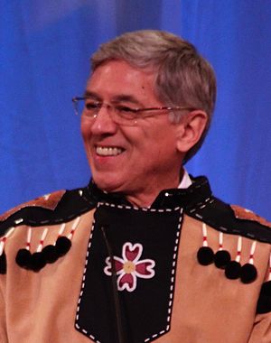 Mallott smiling, wearing native Tlingit dress