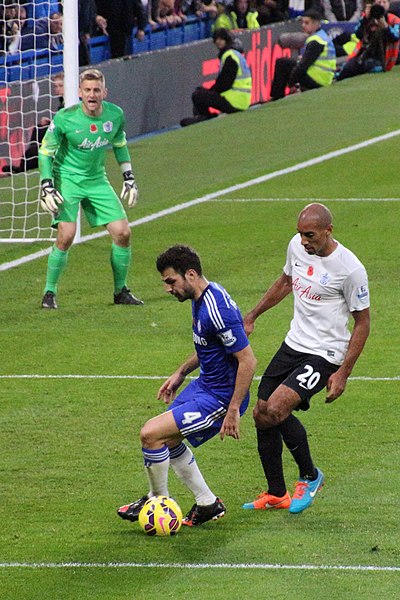 Henry (wearing white) playing for Queens Park Rangers in the West London derby against Chelsea, 2014