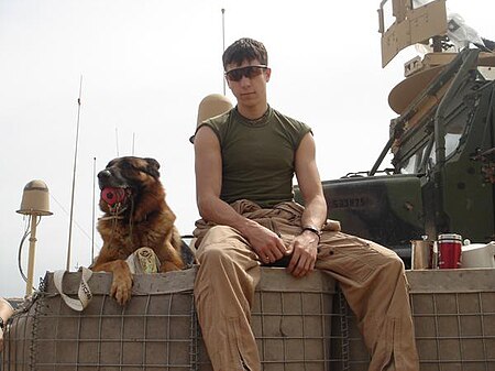 Dustin J. Lee with Lex in Iraq.jpg