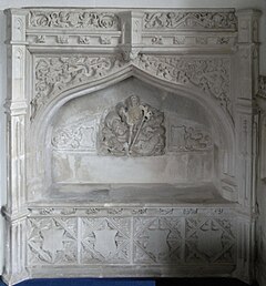 Easter Sepulchre for an unknown member of the Denys family, 16th century, in Holcombe Burnell Church, Devon. Renaissance classical elements are shown such as a classical pediment and Italianate putti, but the whole is contained within a late Gothic arch. EasterSepulchreHolcombeBurnellChurchDevon.JPG