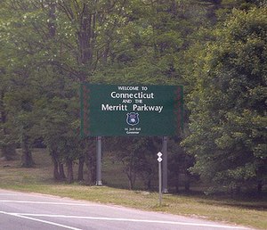 A sign stating "Welcome to Connecticut and the Merritt Parkway"