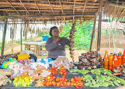 Foodstuff trader at work in the Ikot Nakanda Market