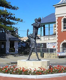 Statue by Robert Hitchcock outside the gates Fremantle Oval of the famous "specky" by South Fremantle Football Club's John Gerovich over East Fremantle Football Club's Ray French at the 1956 WANFL preliminary final. Fremantle Football statue.jpg