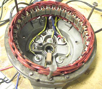 Disassembled automobile alternator, showing the six diodes that comprise a full-wave three-phase bridge rectifier.