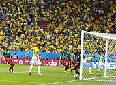 Fred scoring a goal for Brazil as Itandje looks on alongside his compatriots during a group stage match at the 2014 FIFA World Cup Gol fred.jpg