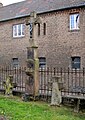 Churchyard / high sandstone cross / grave crosses