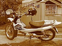 A Honda XRM with modified seat cover