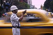 Traffic Police directing cars in Kolkata. India - Kolkata traffic cop - 3661.jpg