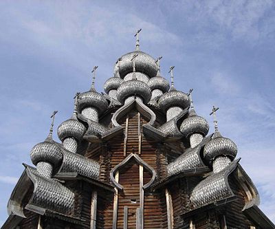 The bochka roofs of the Transfiguration Church in Kizhi, holding onion domes above. 18th century.
